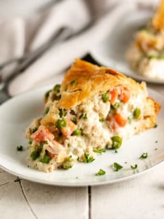 Small plate with a slice of chicken pot pie.