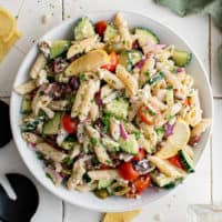 Top down view of a large bowl of greek pasta salad.
