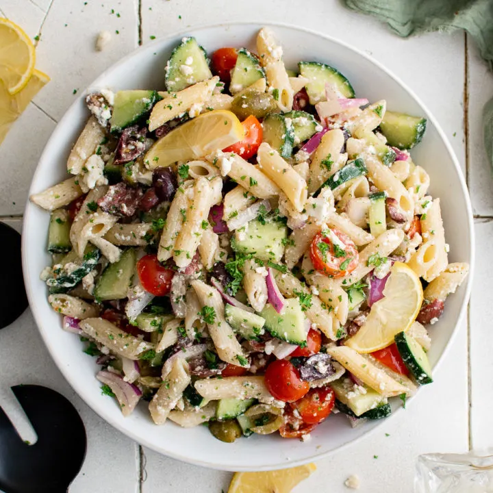 Top down view of a large bowl of greek pasta salad.