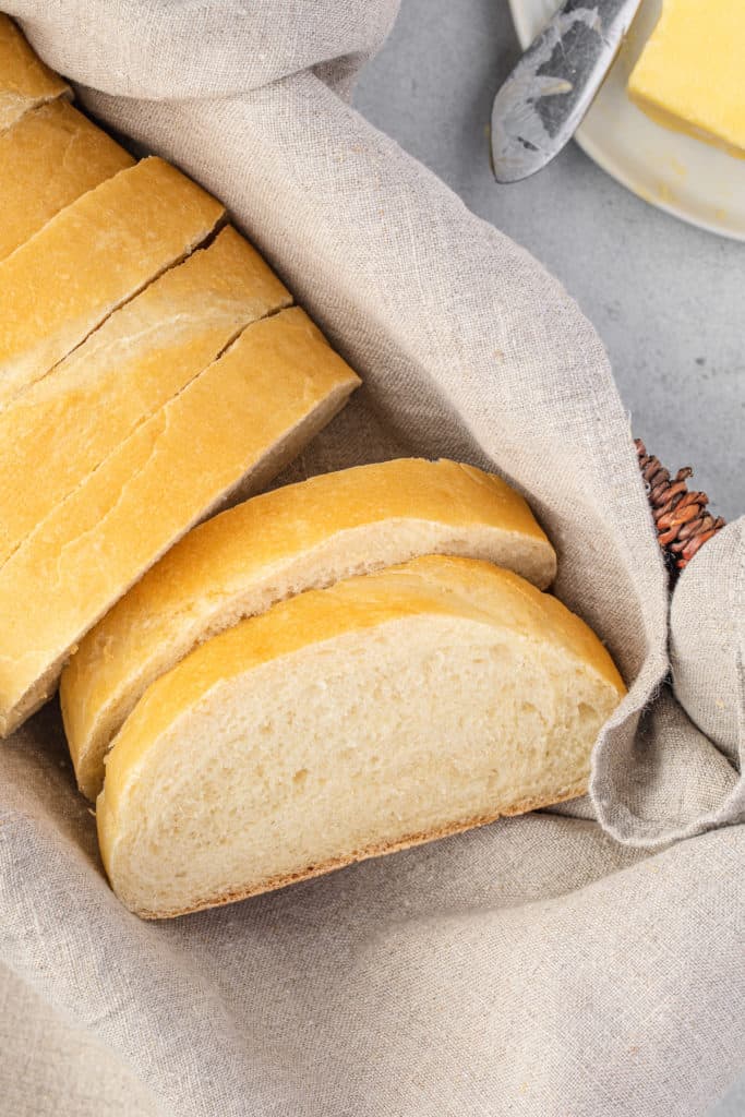 Close up view of sliced bread in a basket.