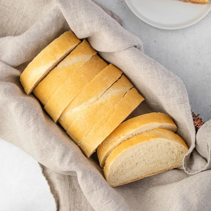 Loaf of italian bread sliced in a basket.