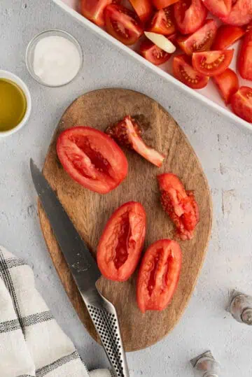 Seed being removed from roma tomatoes.