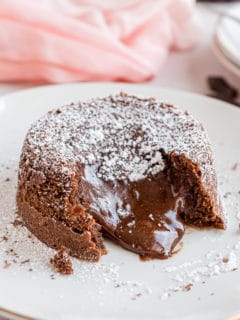 Chocolate lava cake on a small dish.