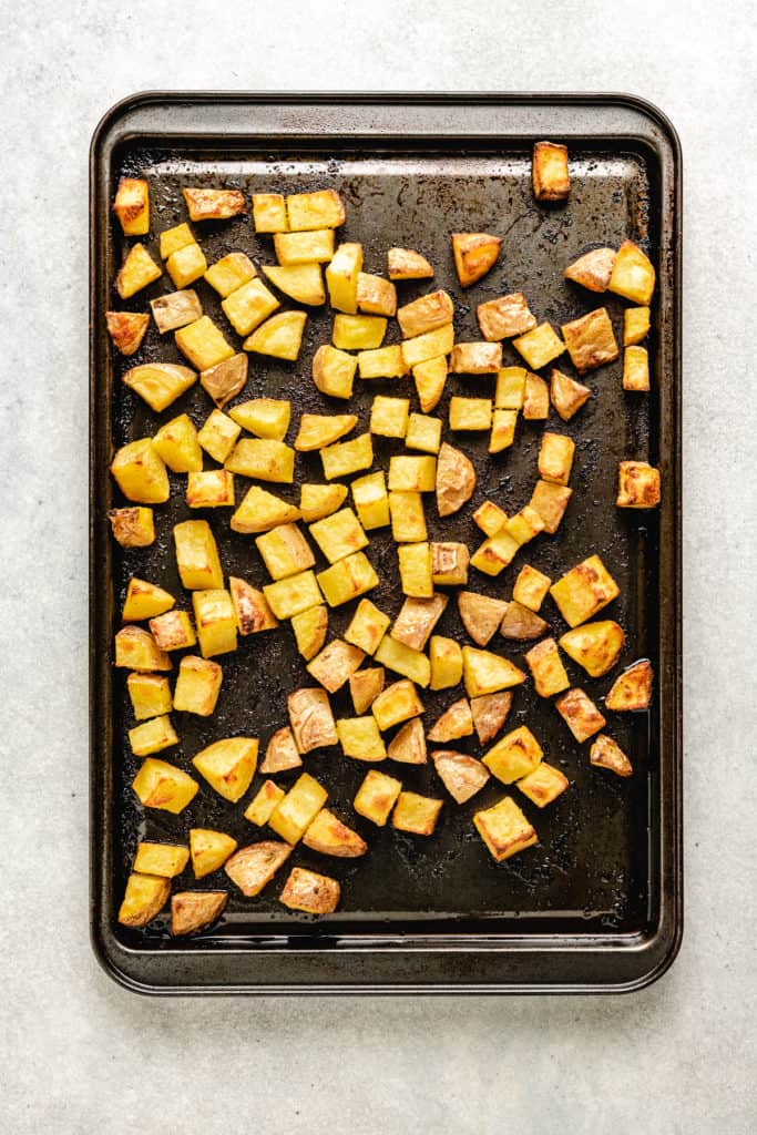 Roasted potatoes on a pan.