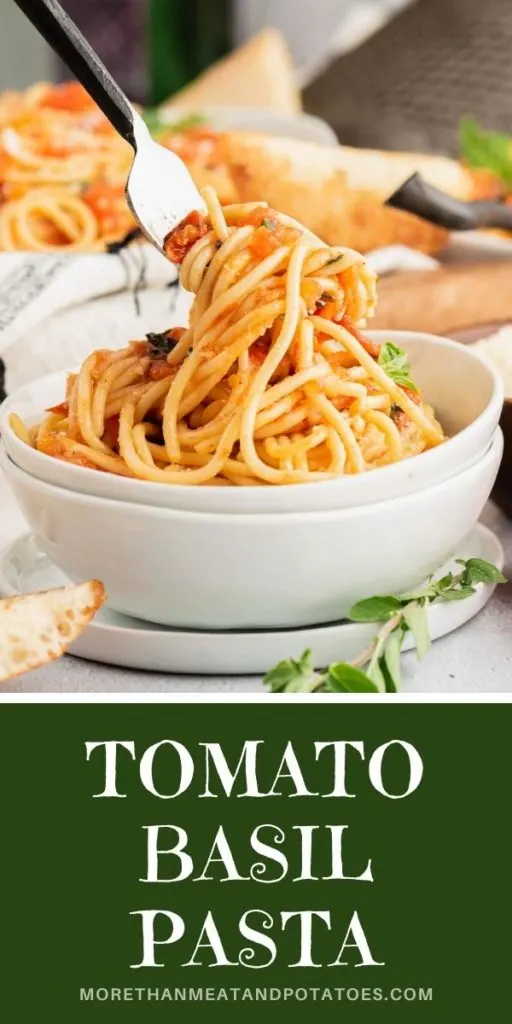 Tomato basil pasta on a fork.