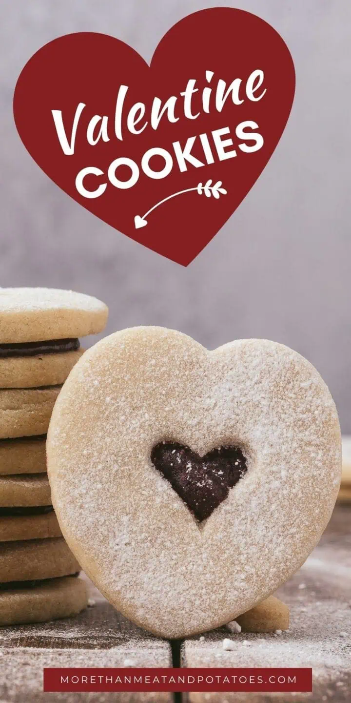 Close up of a heart shaped valentine cookie with jam.