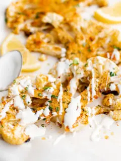 Drizzle of sauce of over roasted cauliflower.