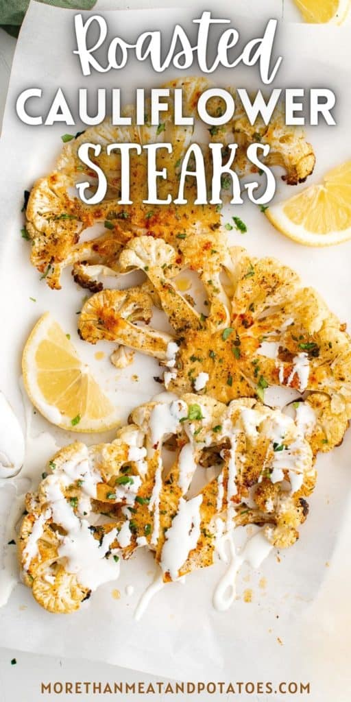 Top down view of roasted cauliflower steaks with lemon and sauce.