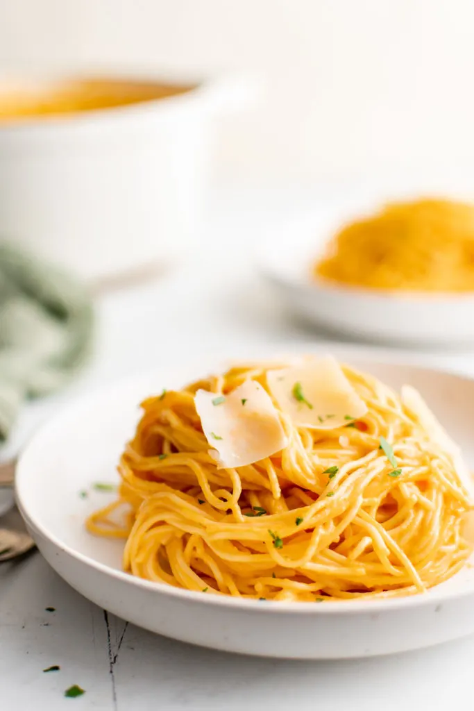 White plate filled with pasta.