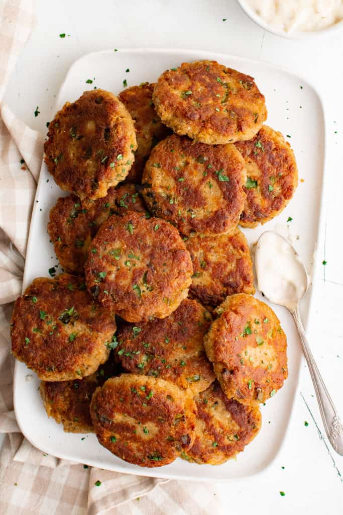 Salmon patties on a platter.