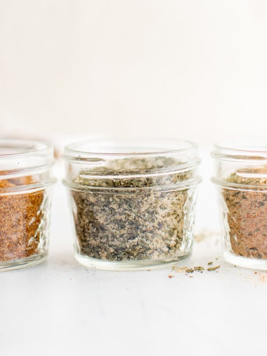 Three different spice blends in jars.