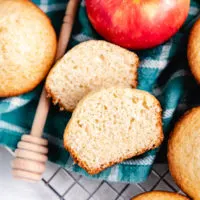 Muffin cut in half with apples.