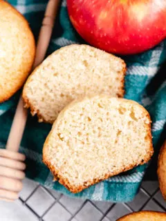 Muffin cut in half with apples.