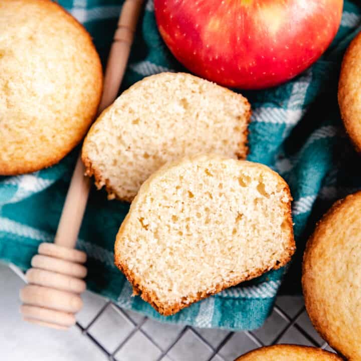 Muffin cut in half with apples.