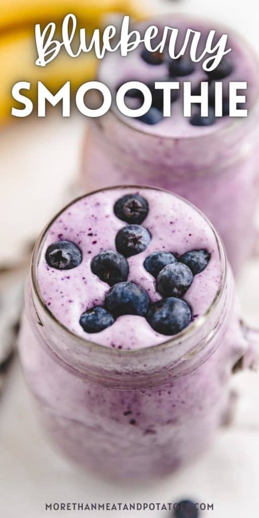Fresh blueberries on top of a blueberry smoothie.
