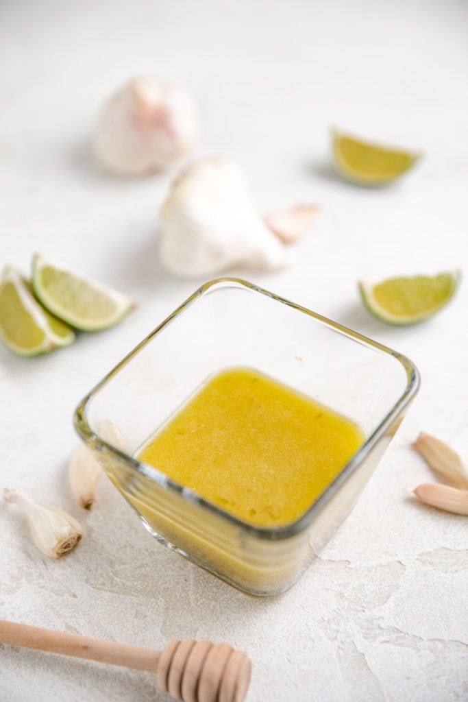 Square bowl of lime vinaigrette.