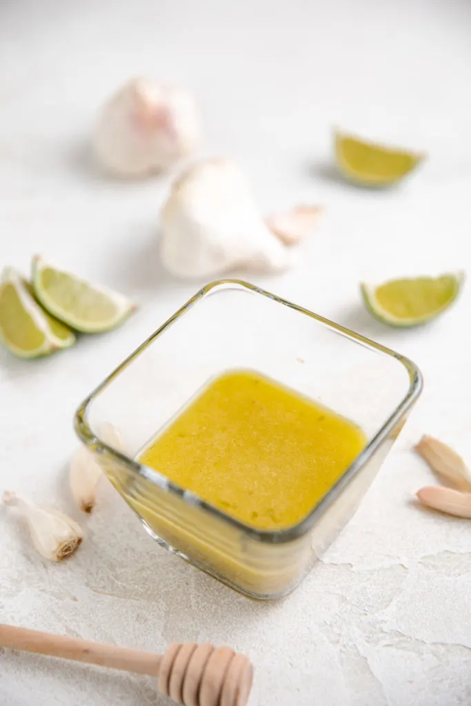 Square bowl of lime vinaigrette.