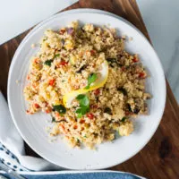 Top down view of summer vegetable couscous in a bowl.