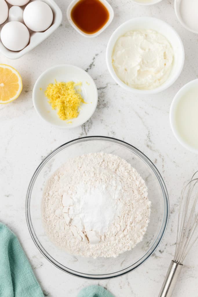 Flour, baking powder, baking soda, and salt in a bowl.
