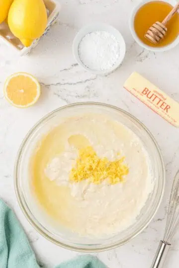 Lemon zest on top of pancake batter.