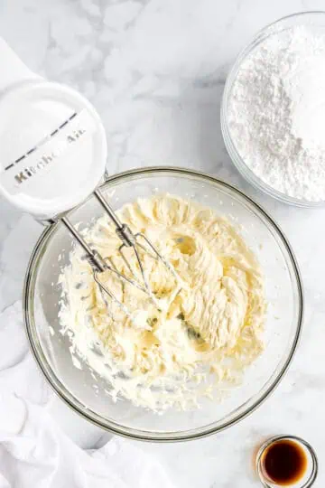 Cream cheese frosting in a bowl.