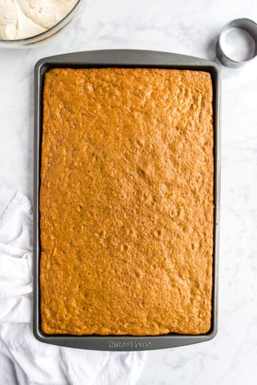 Baked carrot cake on a baking pan.