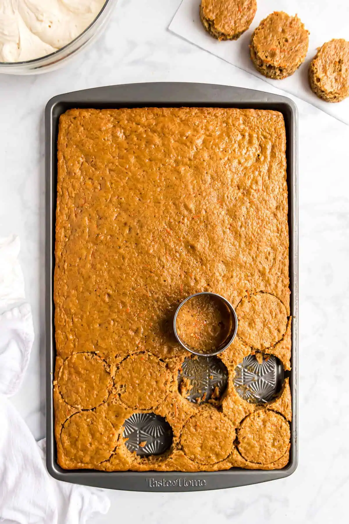 Carrot cake being cut into circles.