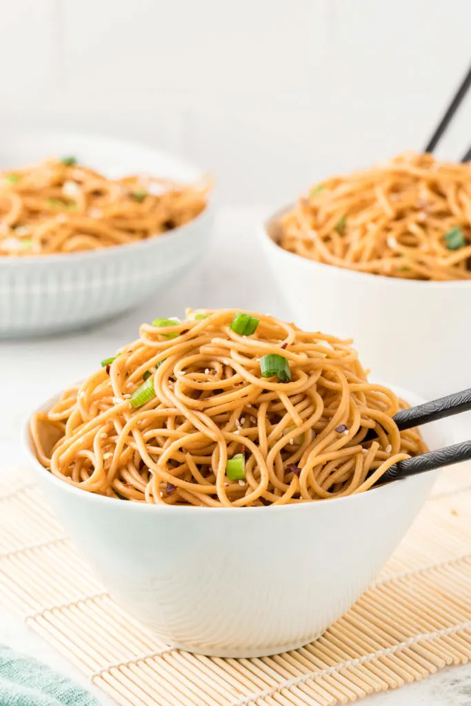 Angled views of noodles in bowls.