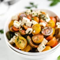Side view of a tomato salad with feta.