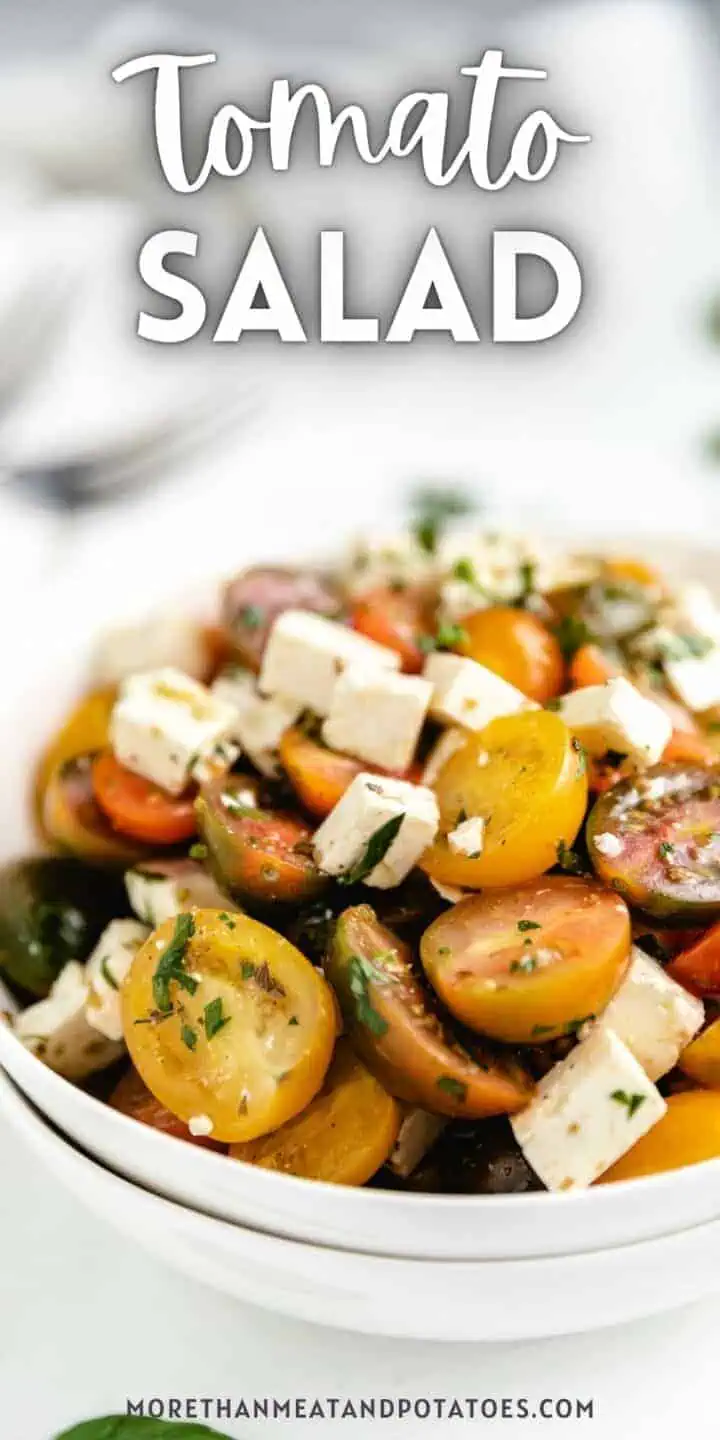 Large white bowl filled with tomato salad.