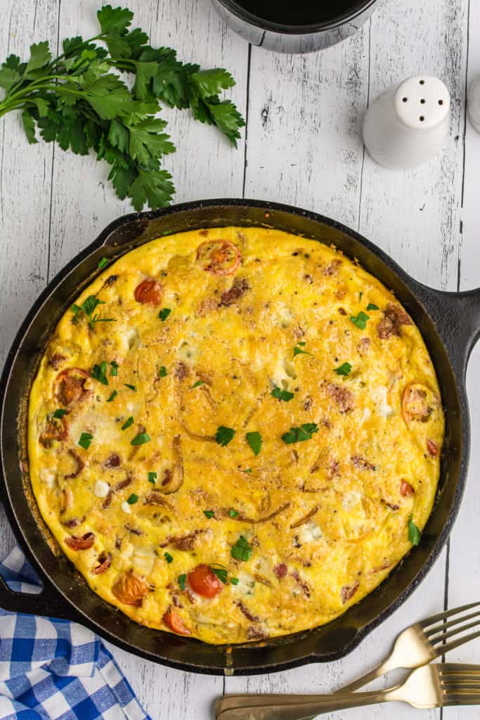 Top down view of a frittata in a skillet.