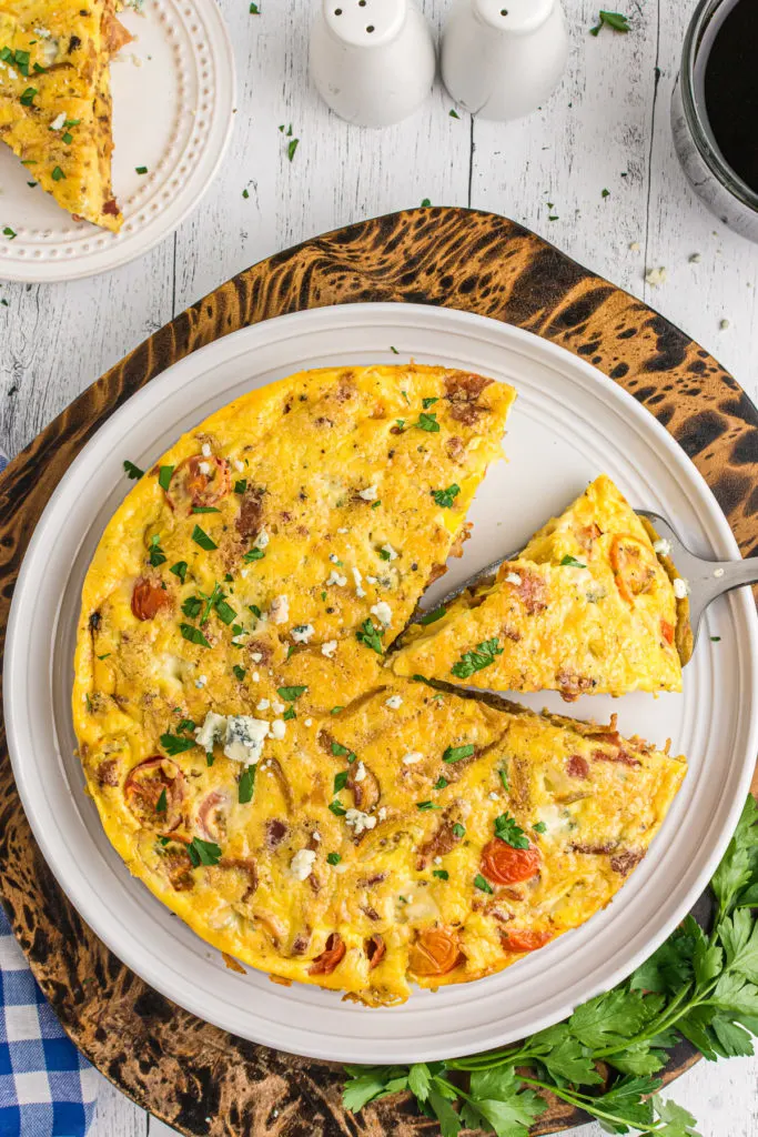 Sliced frittata on a serving platter.