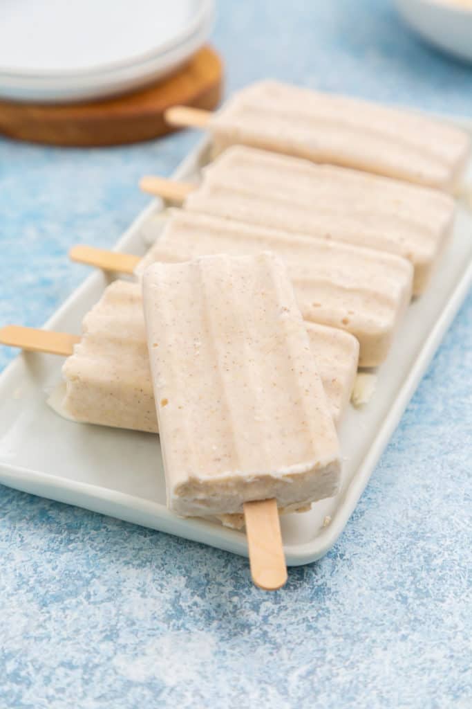 Several tropical popsicles on a platter.