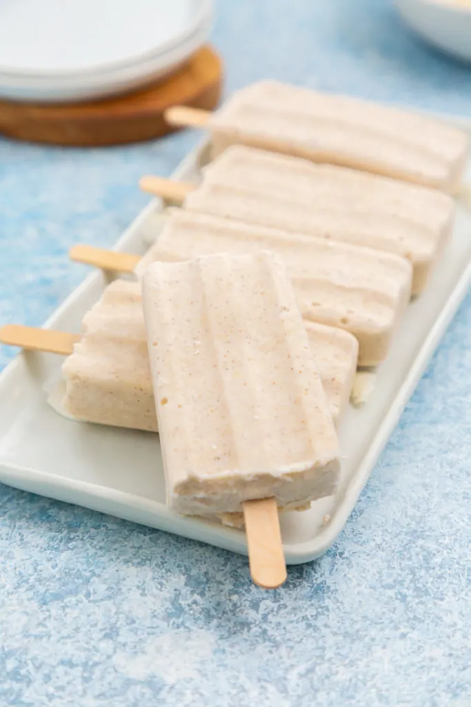 Several tropical popsicles on a platter.