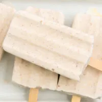 Coconut popsicles on a platter.