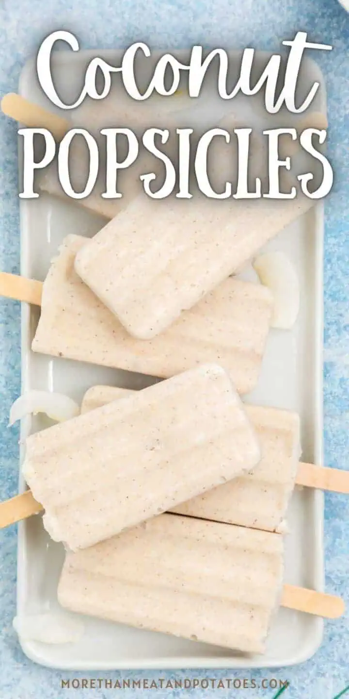 Top down view of a pan of coconut popsicles.