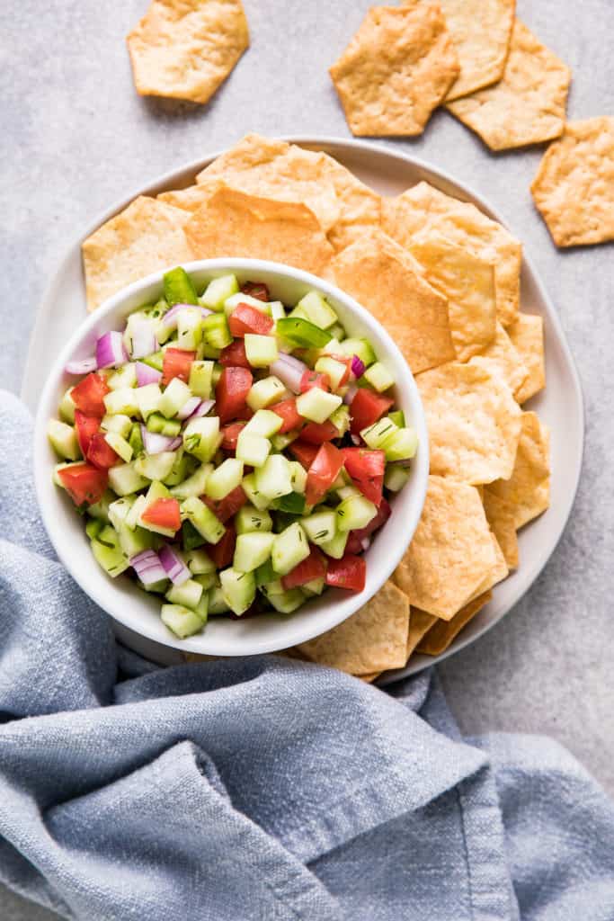 Top down view of cucumber salsa and crackers.
