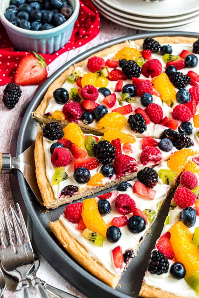 Sliced pizza with fruit.