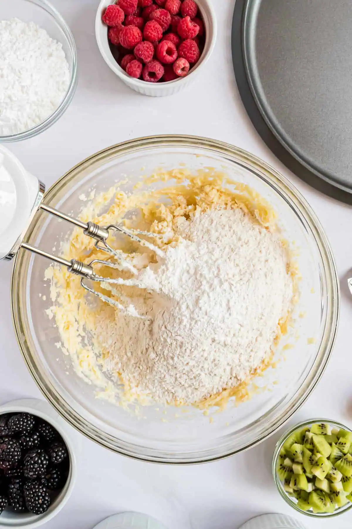 Ingredients for a sugar cookie crust in a bowl.