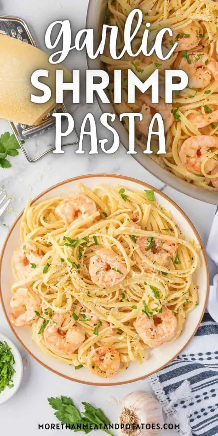 Close up view of garlic shrimp pasta on a serving dish.