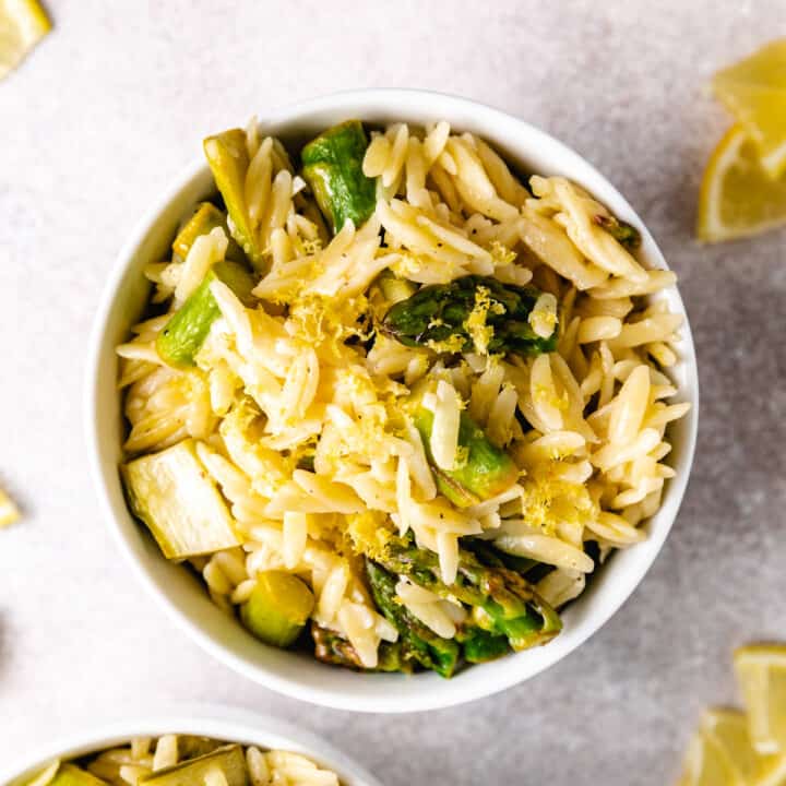 Top down view of a bowl of lemon asparagus orzo.