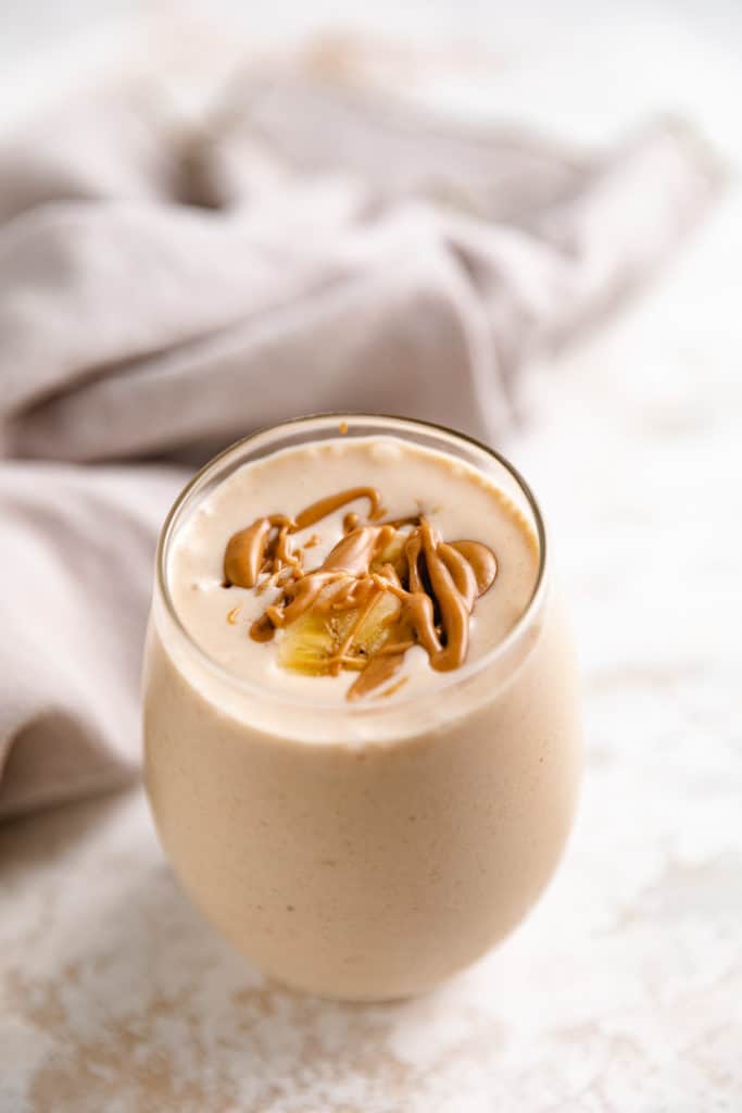 Peanut butter smoothie in a glass.