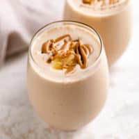 Two glasses of peanut butter banana smoothie.