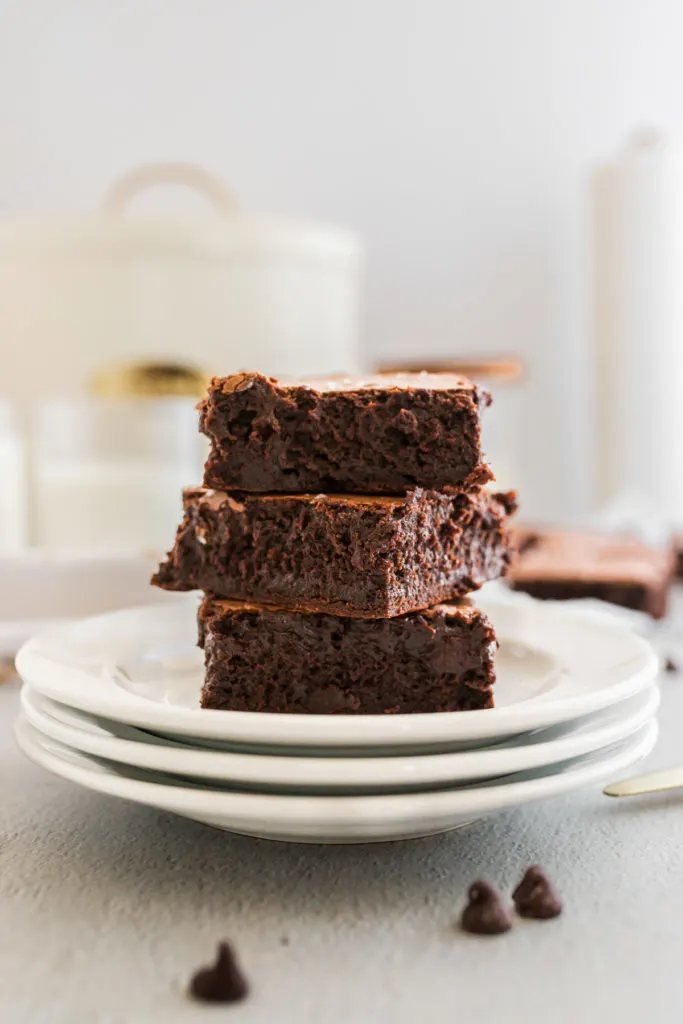 Plate of brownies in a stack.