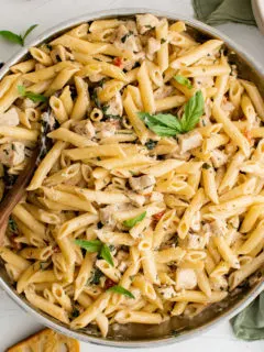 Tuscan chicken pasta in a pan.