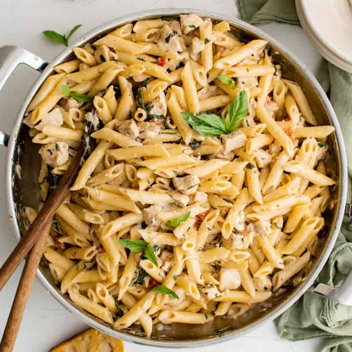 Tuscan chicken pasta in a pan.