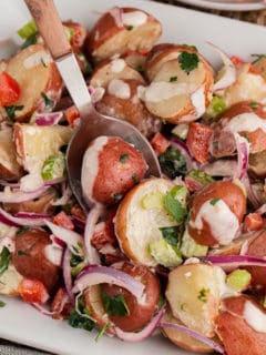 Close up view of red potato salad.