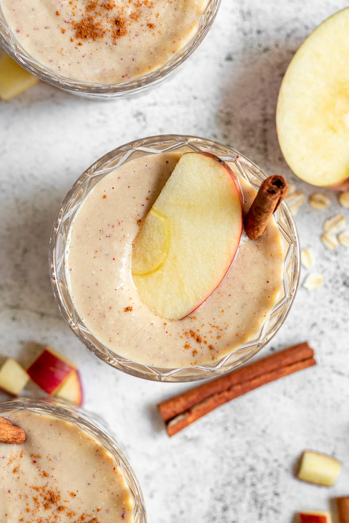 Apple slice on top of a smoothie.