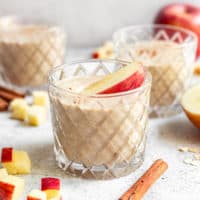 Apple banana smoothies in glasses.