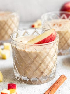 Apple banana smoothies in glasses.